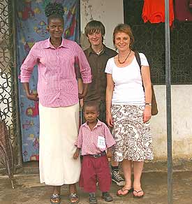 Jenny (right) with Joe are visiting the small Brian with his mother at their home in Kenya.